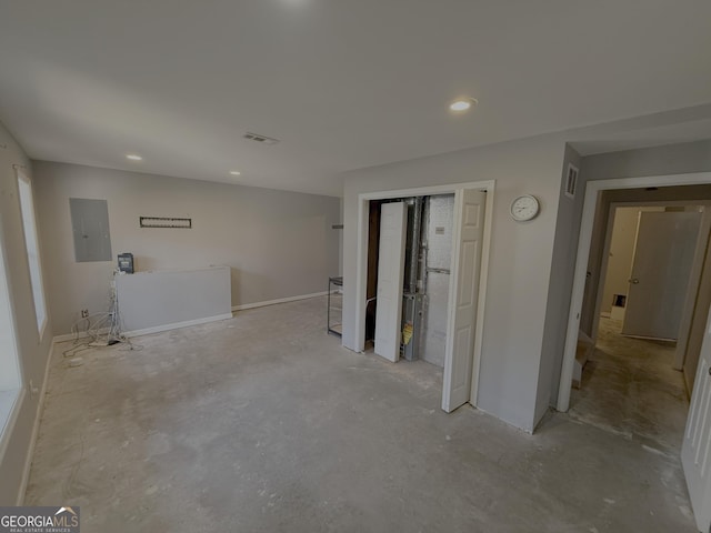 interior space featuring recessed lighting, electric panel, and visible vents