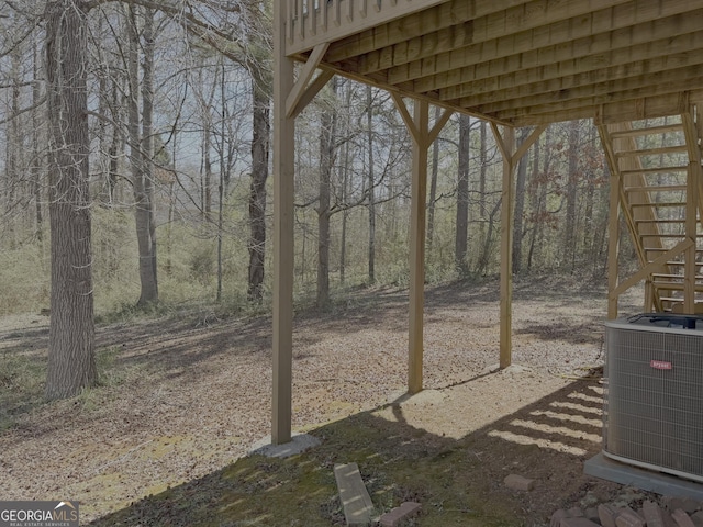 view of yard featuring stairs and cooling unit