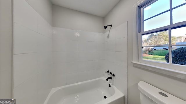 full bathroom featuring tub / shower combination and toilet