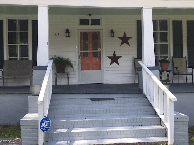 doorway to property featuring a porch