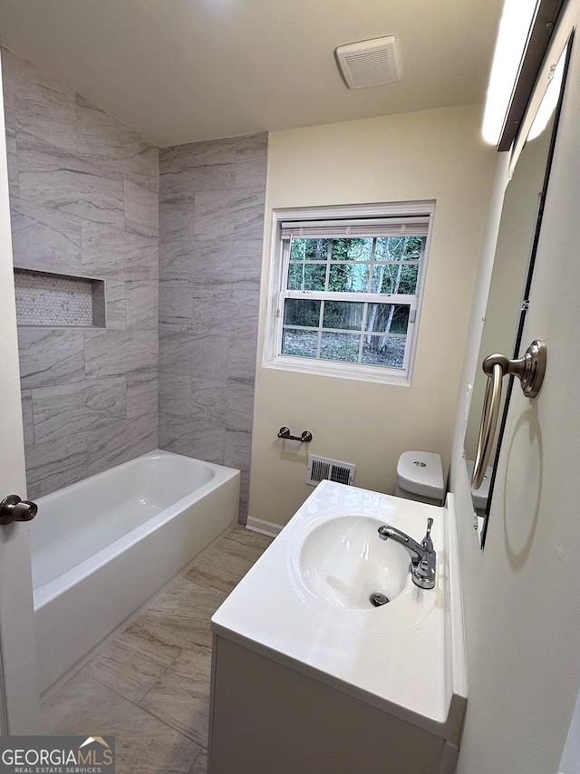 bathroom featuring visible vents and vanity