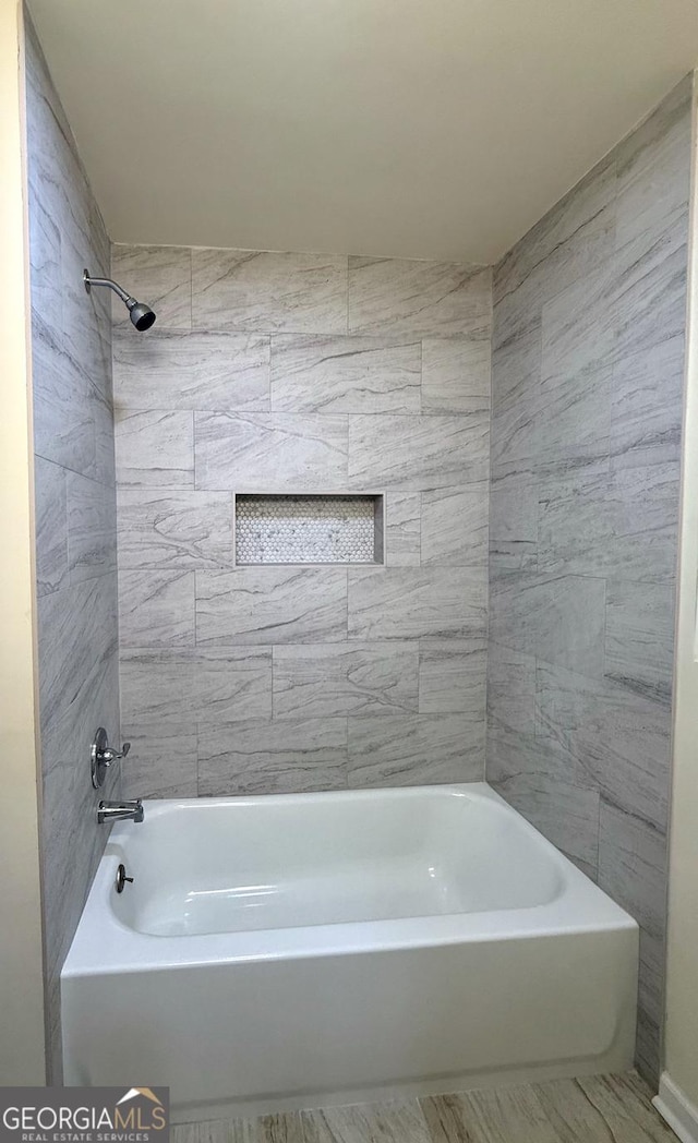 bathroom with shower / washtub combination