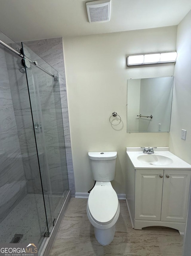 bathroom featuring visible vents, toilet, a stall shower, vanity, and baseboards