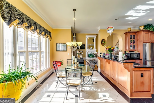 kitchen featuring crown molding, light tile patterned floors, dark countertops, glass insert cabinets, and black microwave