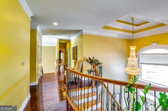 hallway featuring recessed lighting, dark wood-type flooring, ornamental molding, an upstairs landing, and baseboards