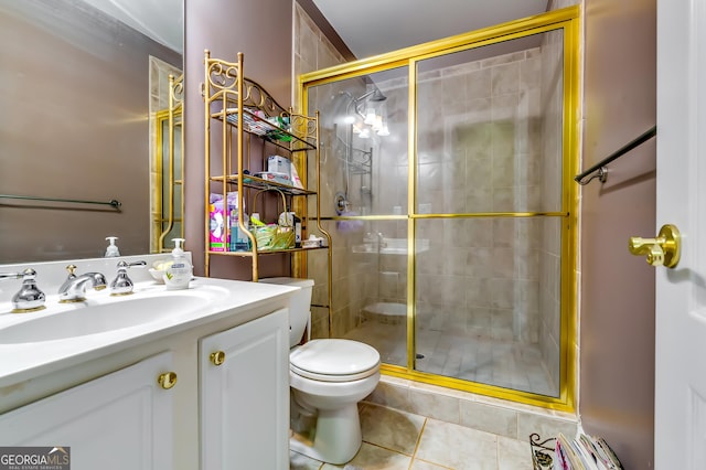 full bathroom with toilet, a shower stall, tile patterned flooring, and vanity