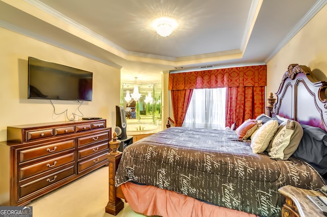 bedroom featuring carpet floors, a chandelier, a raised ceiling, and crown molding