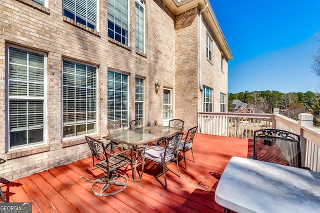 wooden deck with outdoor dining area