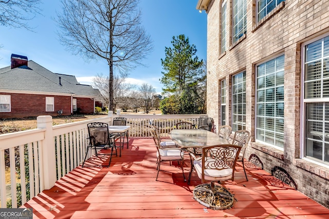 deck with outdoor dining space