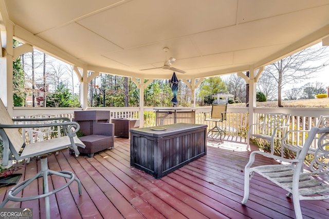 wooden deck with ceiling fan