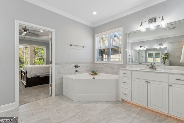 full bathroom featuring vanity, tile walls, a bath, ensuite bath, and crown molding