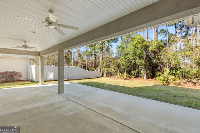 view of patio / terrace with ceiling fan and fence