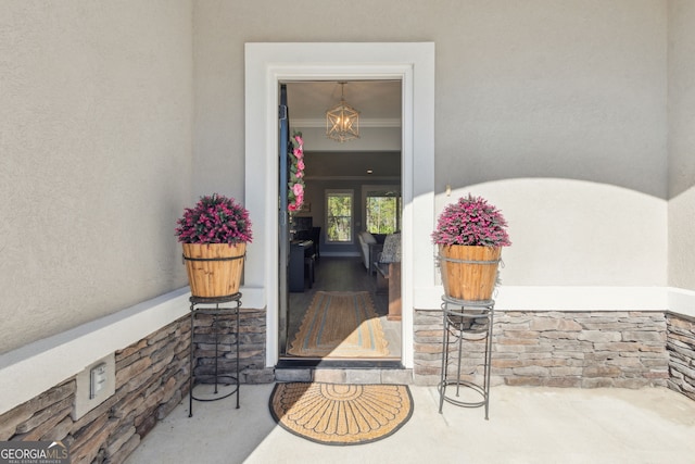 property entrance featuring stucco siding