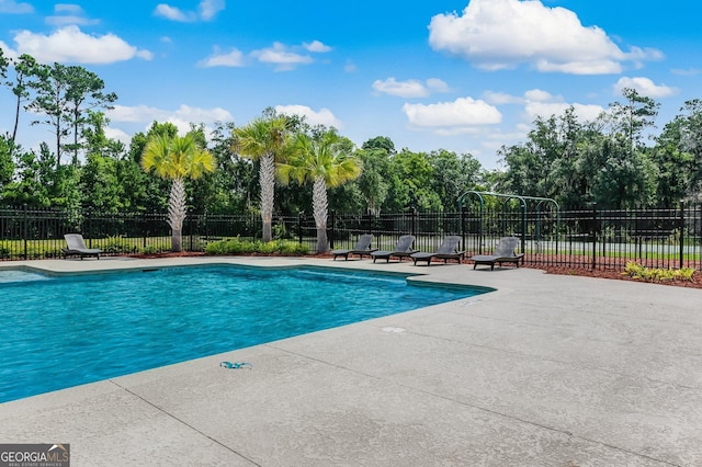 view of pool featuring a patio, fence, and a fenced in pool