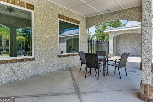 view of patio / terrace featuring fence and outdoor dining space