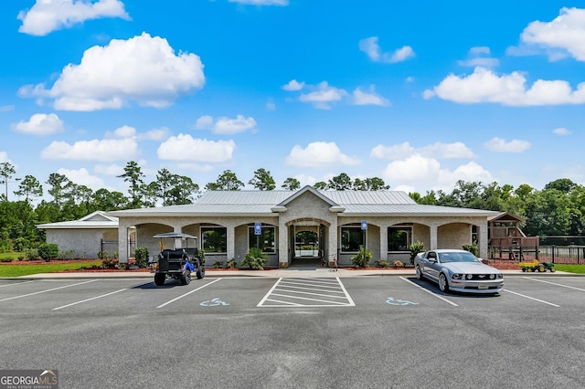 view of property with uncovered parking