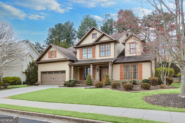 craftsman house with a garage, stone siding, concrete driveway, and a front yard