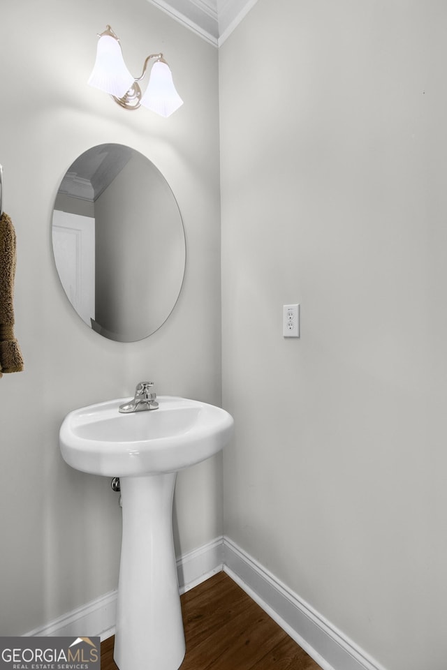 bathroom featuring baseboards and wood finished floors