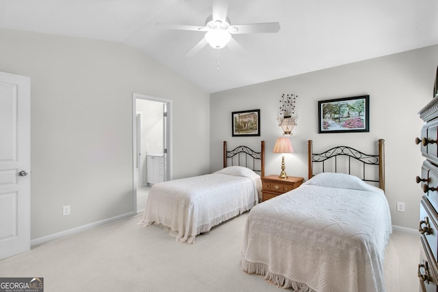 bedroom with vaulted ceiling, carpet floors, connected bathroom, and baseboards