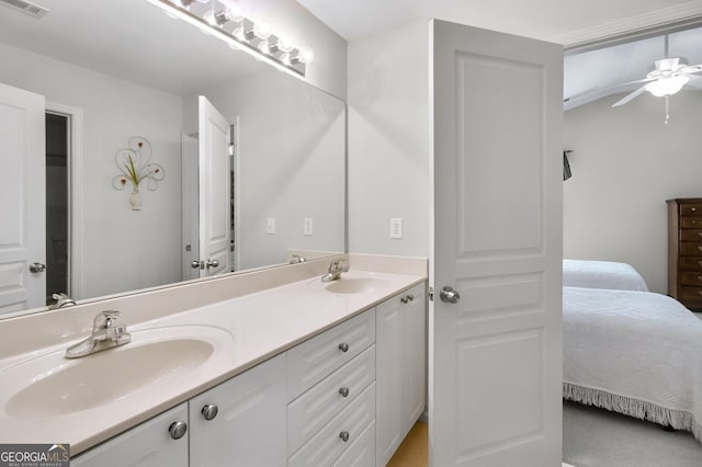 bathroom featuring connected bathroom, visible vents, a sink, and double vanity