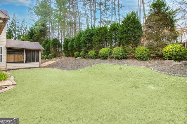 view of yard featuring a sunroom