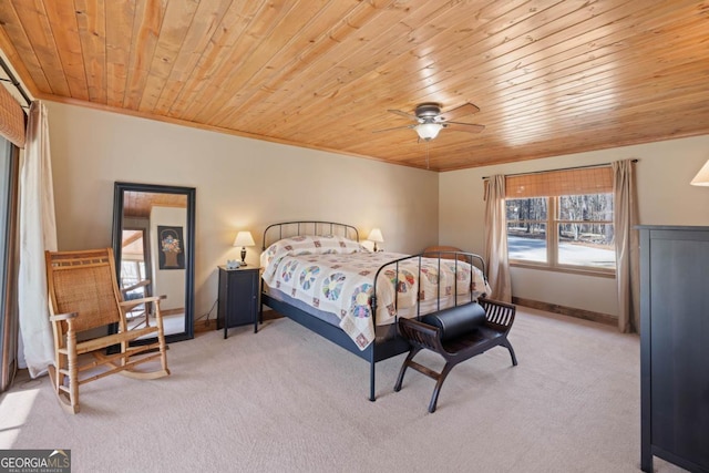 bedroom featuring light carpet, wood ceiling, baseboards, and ceiling fan