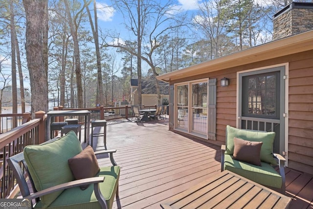 wooden deck with outdoor dining space