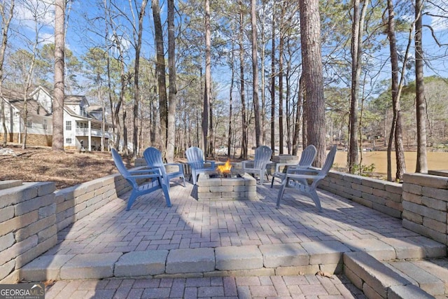 view of patio / terrace featuring an outdoor fire pit