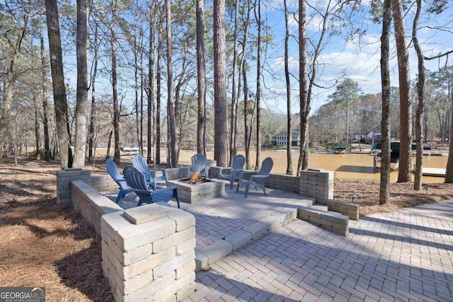 view of patio / terrace with a fire pit