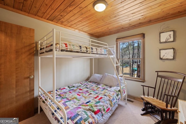 carpeted bedroom featuring wood ceiling and visible vents