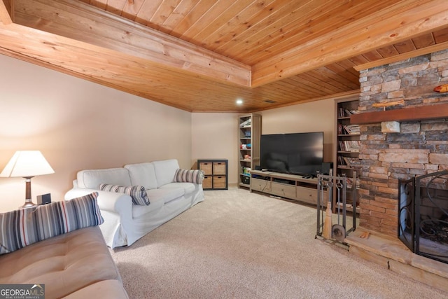 living area featuring carpet floors, wooden ceiling, and a fireplace