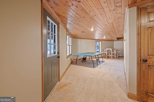 playroom featuring carpet flooring, wood ceiling, and baseboards