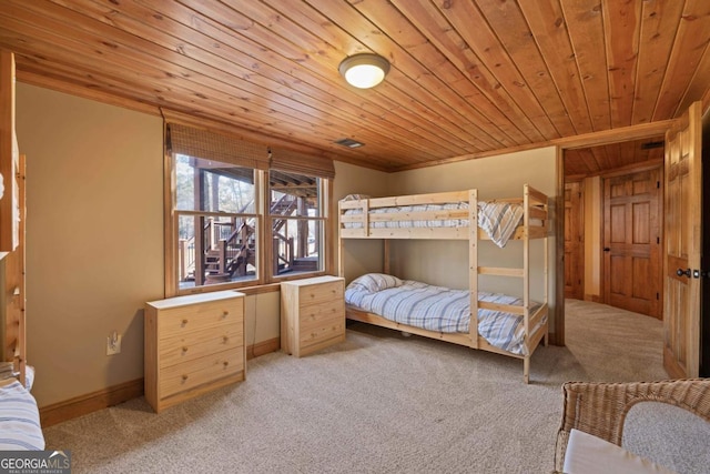 carpeted bedroom with wooden ceiling, visible vents, and baseboards