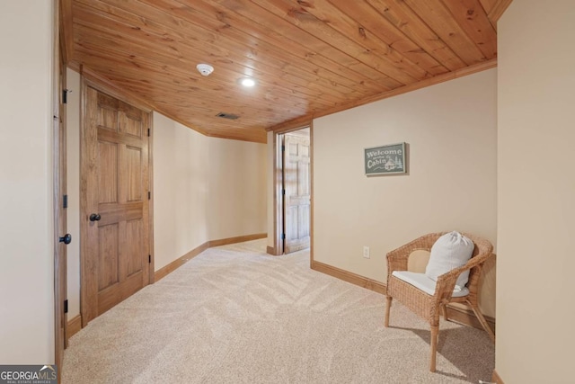 living area with wooden ceiling, carpet, baseboards, and ornamental molding