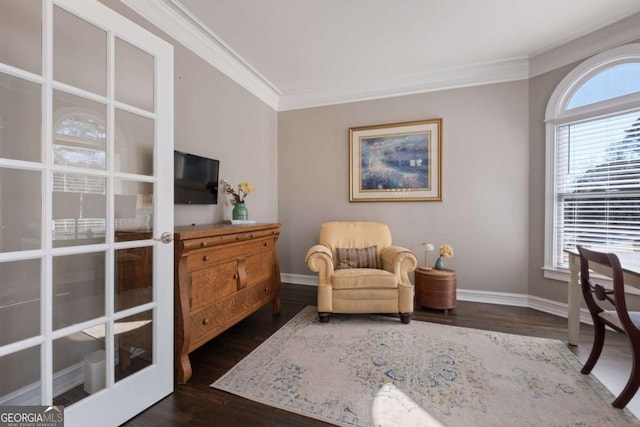 living area with dark wood finished floors, french doors, crown molding, and baseboards