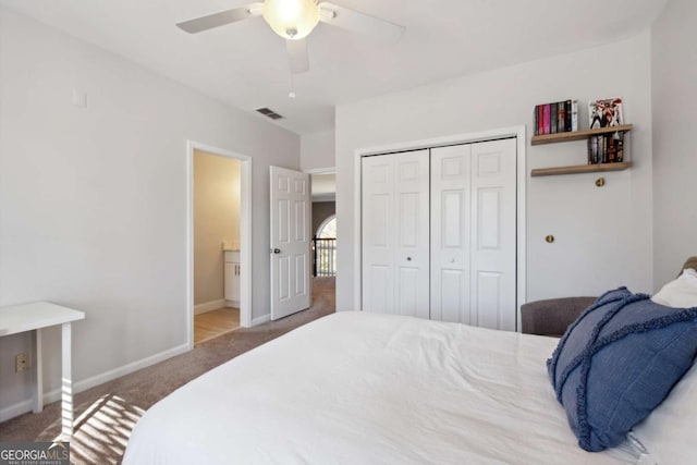 bedroom featuring baseboards, visible vents, ceiling fan, carpet flooring, and a closet