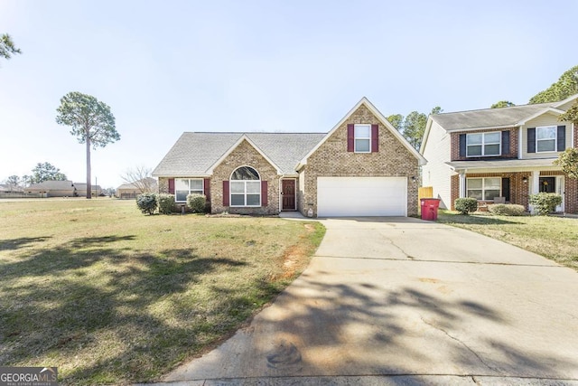 view of front facade with driveway, brick siding, a garage, and a front yard