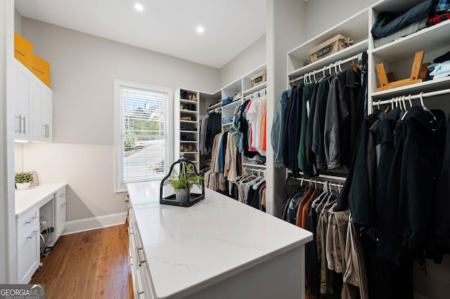 spacious closet with wood finished floors