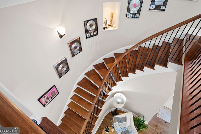 stairway with wood finished floors