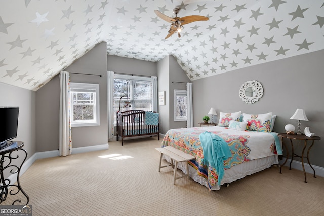 bedroom with carpet floors, ceiling fan, baseboards, and vaulted ceiling