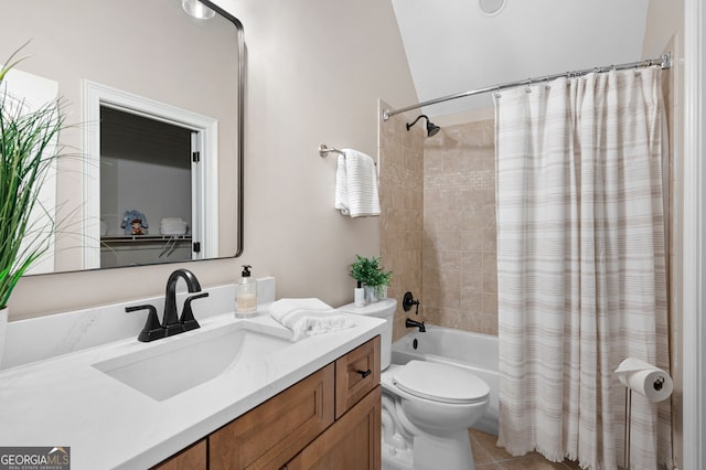 full bathroom featuring toilet, tile patterned floors, vanity, and shower / bathtub combination with curtain