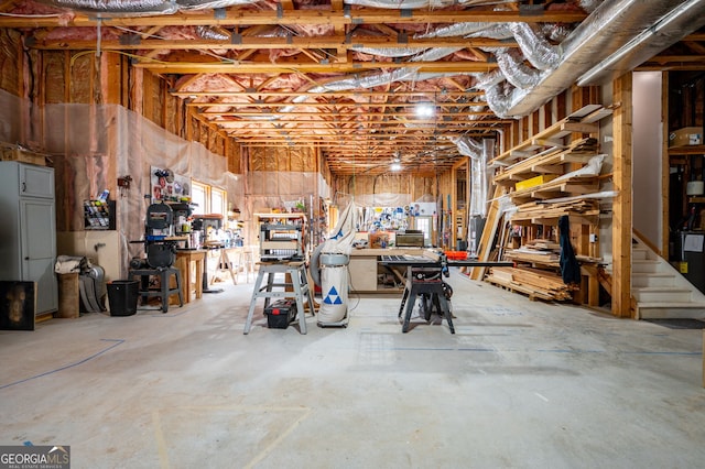 unfinished basement with a workshop area