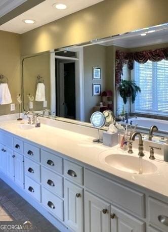 full bathroom with recessed lighting, a sink, and double vanity