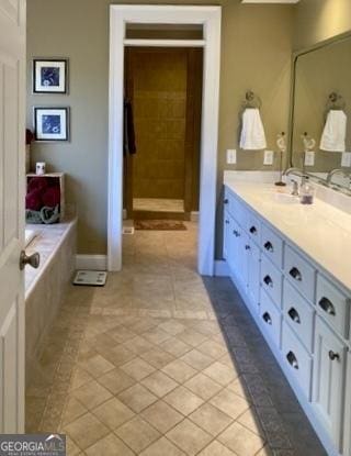 full bath with vanity and tile patterned floors