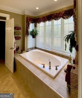 bathroom featuring tile patterned floors, a bath, and crown molding