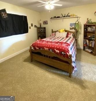 bedroom with ceiling fan, carpet, and baseboards