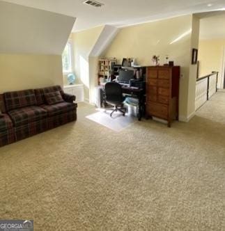 home office with lofted ceiling, carpet flooring, and visible vents