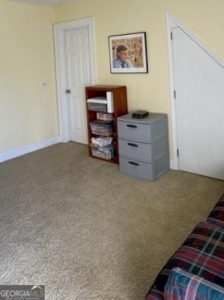 carpeted bedroom with baseboards