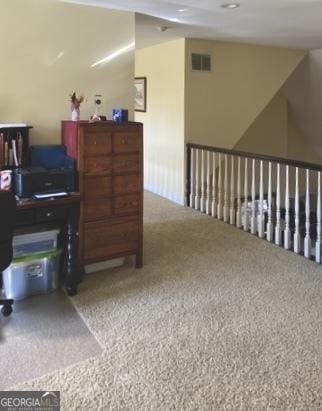 office area featuring carpet flooring and visible vents