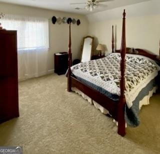 carpeted bedroom featuring lofted ceiling and ceiling fan